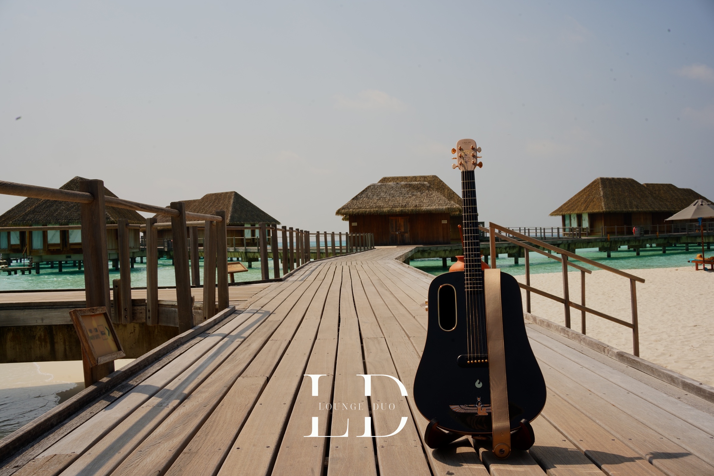 LoungeDuo's guitar on a jetty in the Maldives