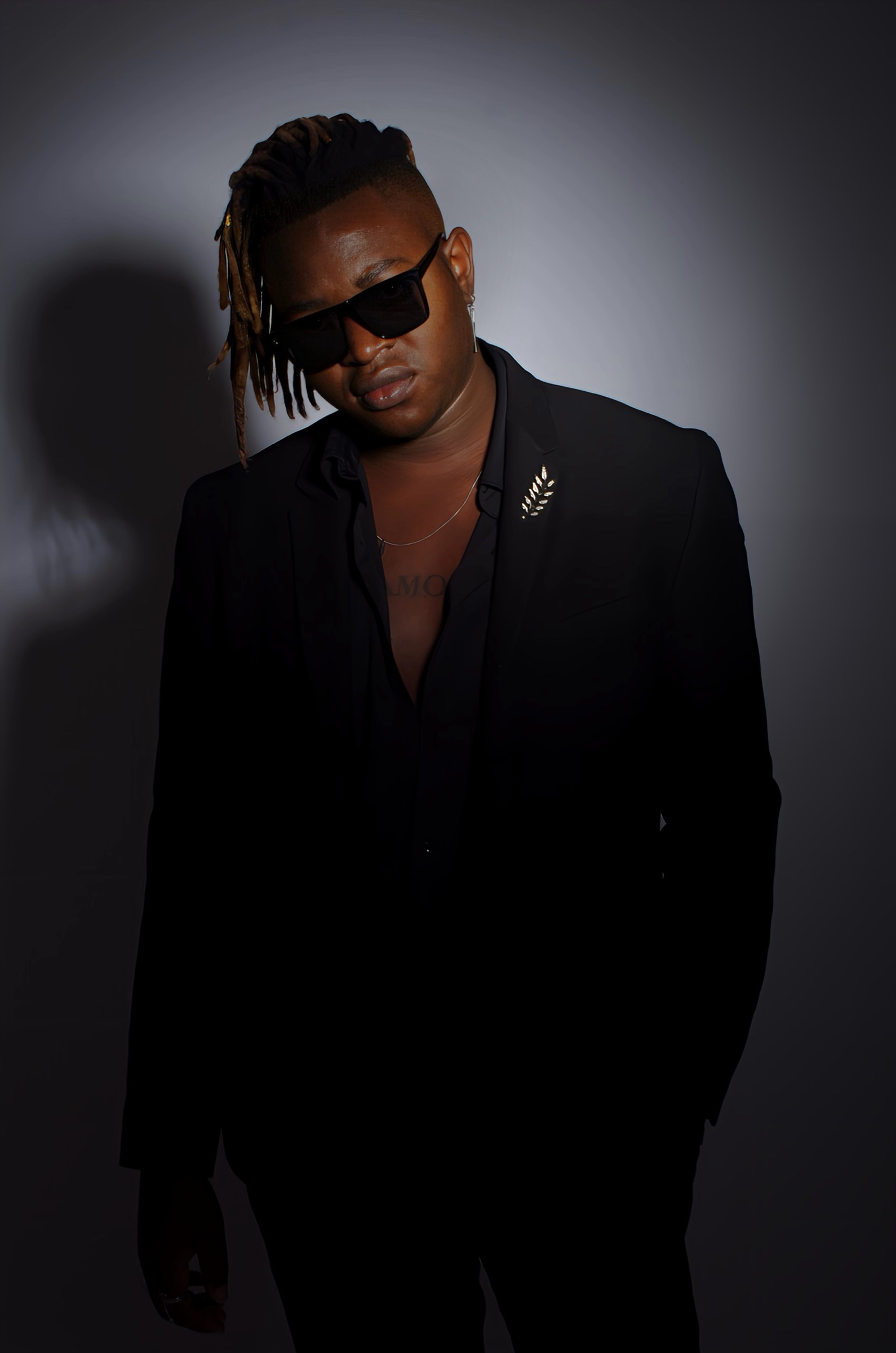 Portrait of Eric Maseko in a black suit