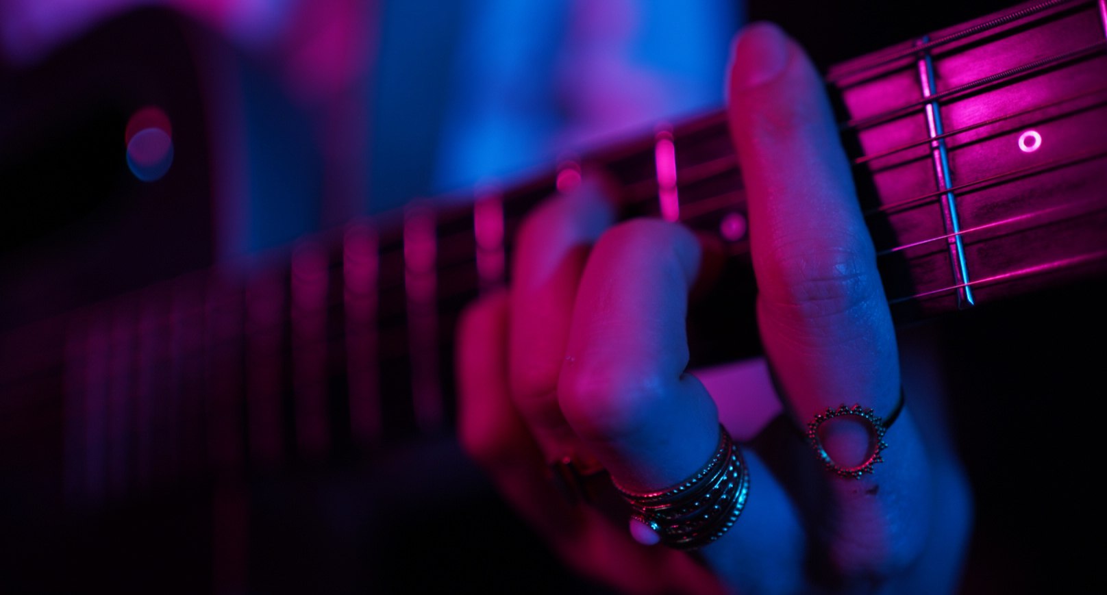 Guitar detail under stage lights