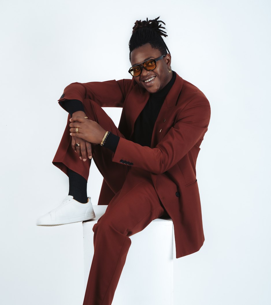 Portrait of Eric Maseko in a burgundy suit