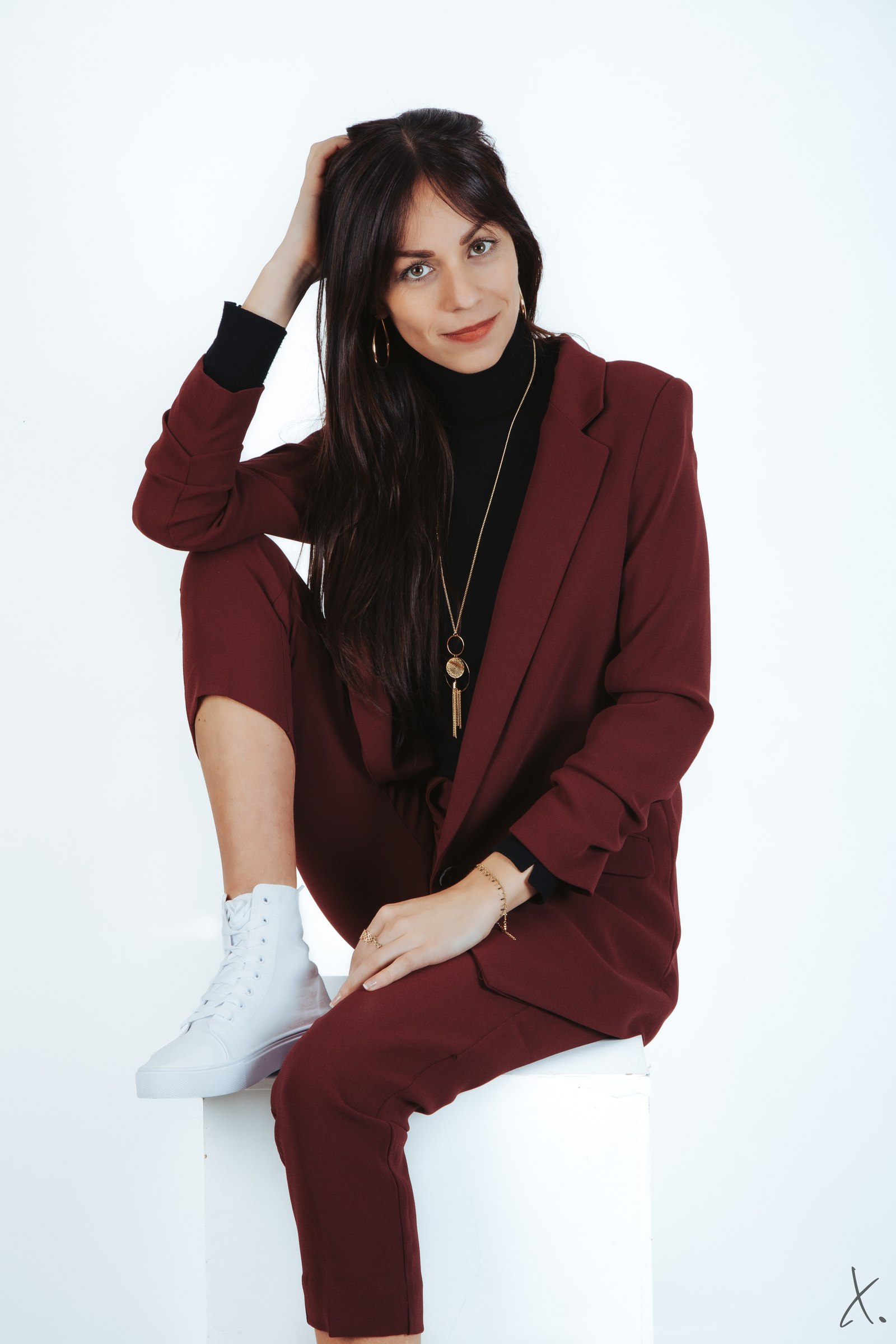 Portrait of Marie in a burgundy suit