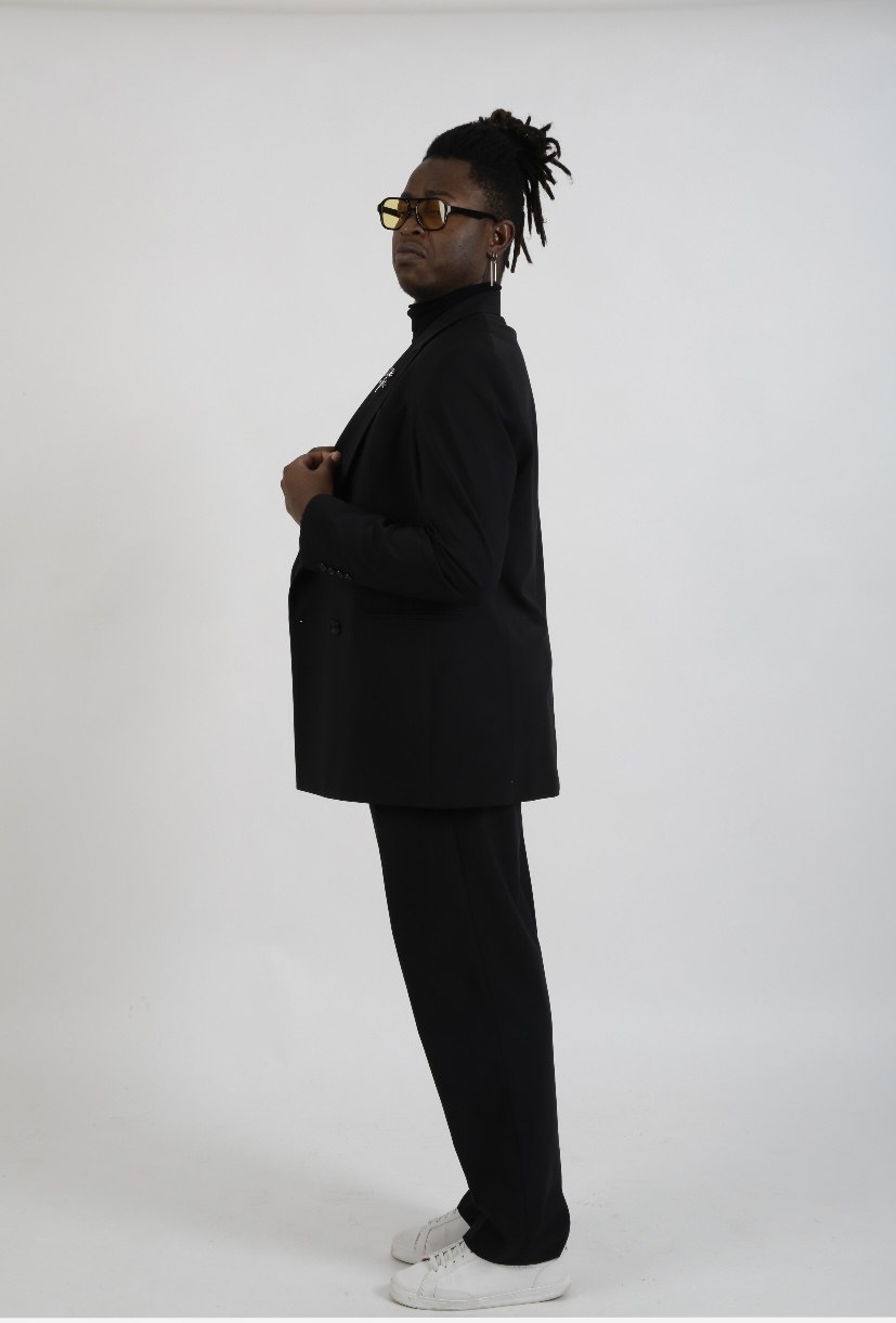Portrait of Eric Maseko dressed in black