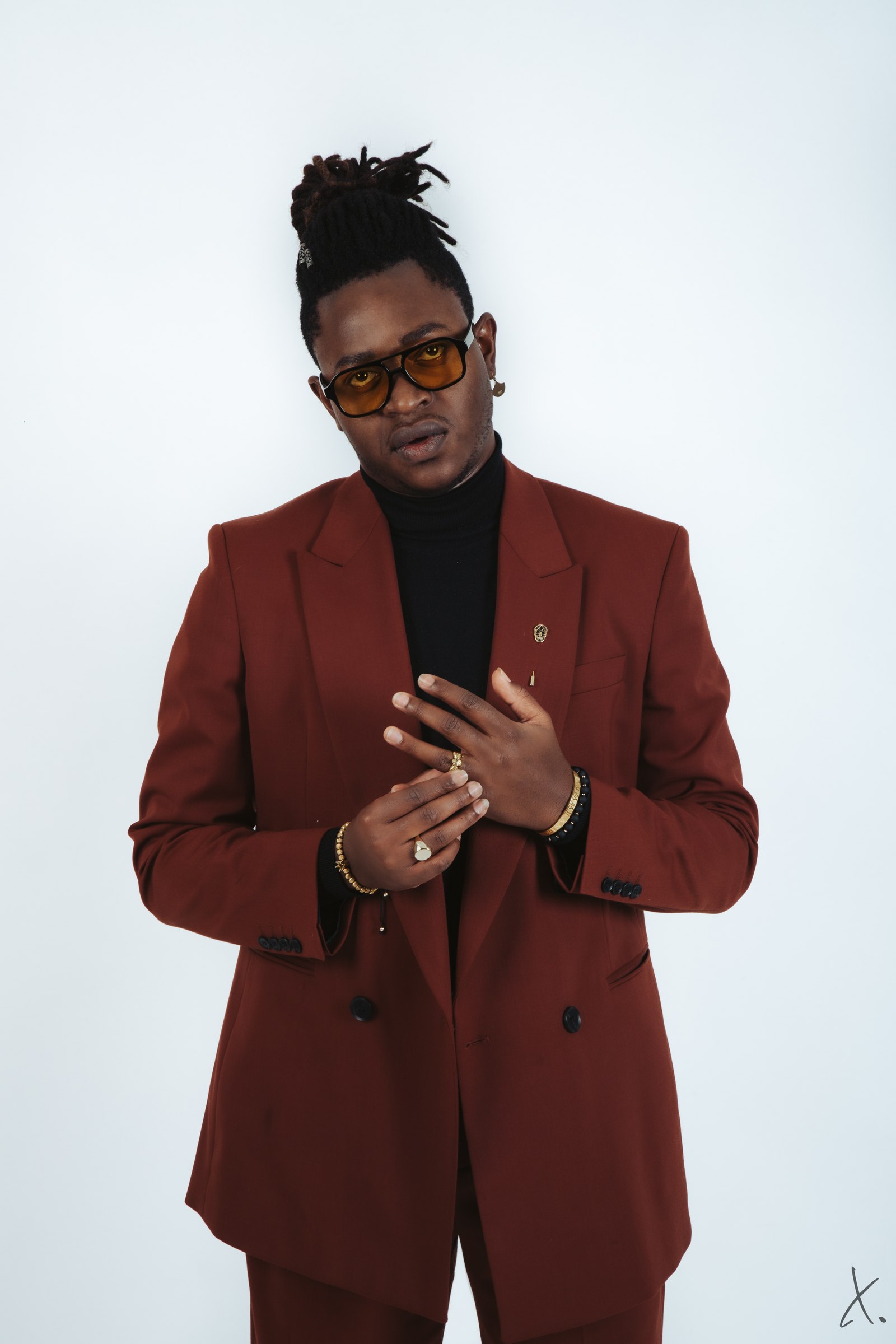 Eric Maseko in a burgundy suit