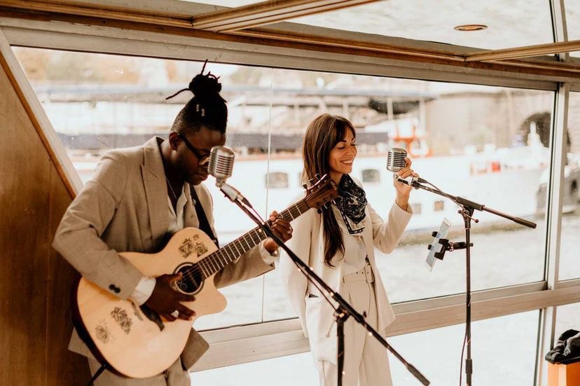 LoungeDuo performing an acoustic set beneath a glass roof