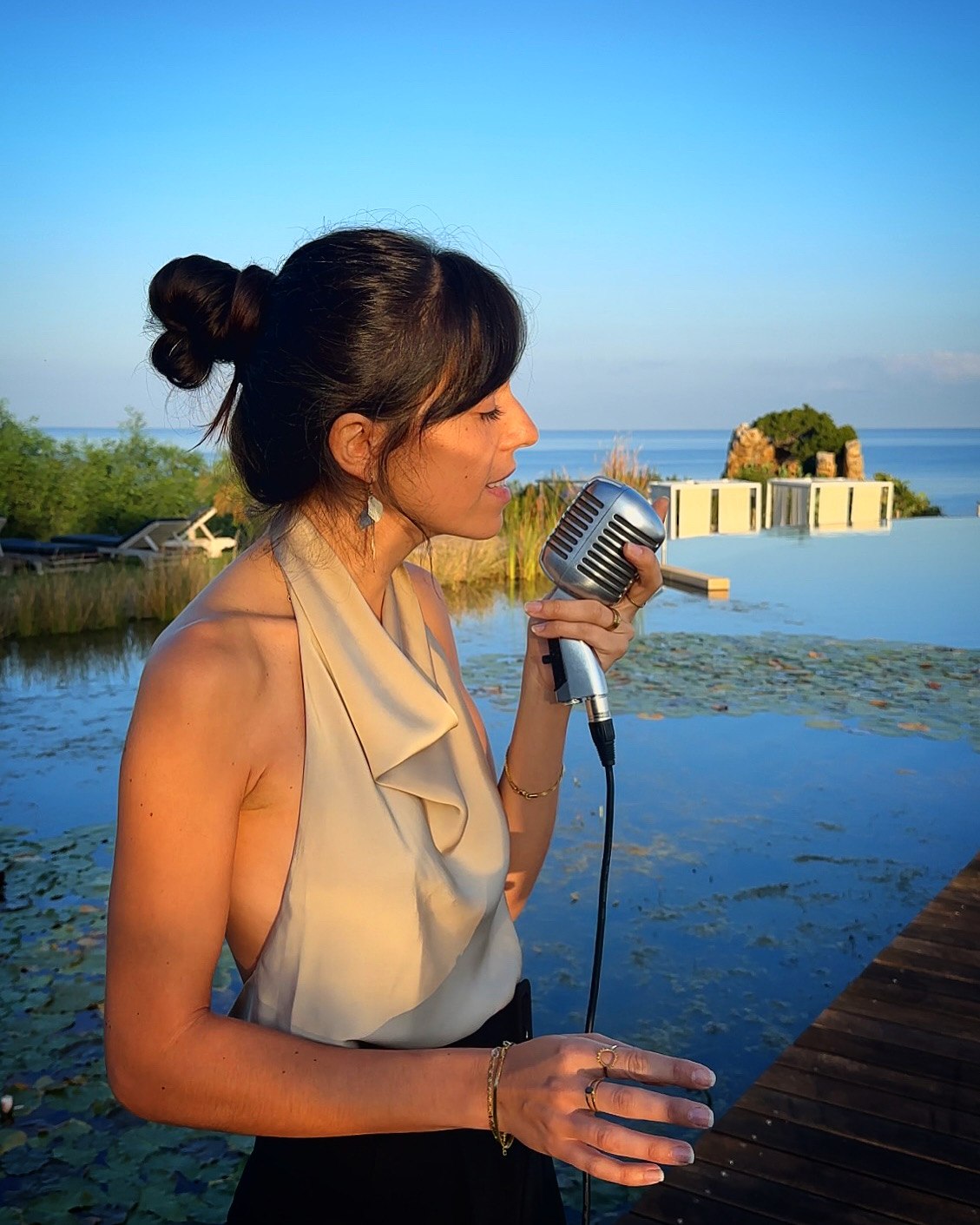Marie singing by the water